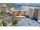 Aerial view of a condo building with waterfront access and ample parking at 5130 Brittany S Dr # 208, St Petersburg, FL 33715