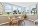 Sunroom with wicker chairs and stunning water views at 5130 Brittany S Dr # 208, St Petersburg, FL 33715