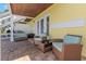 Enjoy this relaxing patio with wicker chairs and a small table at 105 Pompano Se Dr # A, St Petersburg, FL 33705