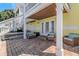 Relaxing patio with wicker furniture and a grill at 105 Pompano Se Dr # A, St Petersburg, FL 33705