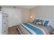 Bedroom with dresser, double bed, and large closet at 105 Pompano Se Dr # A, St Petersburg, FL 33705
