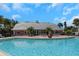 Community pool and clubhouse view at 105 Pompano Se Dr # A, St Petersburg, FL 33705