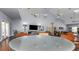 Community room with seating, TV, and game tables at 105 Pompano Se Dr # A, St Petersburg, FL 33705