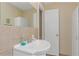 Bathroom with single sink vanity and tiled walls at 105 Pompano Se Dr # A, St Petersburg, FL 33705