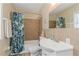 Bathroom with tub, shower, and white vanity at 105 Pompano Se Dr # A, St Petersburg, FL 33705