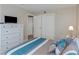 Bedroom with dresser, double bed, and large closet at 105 Pompano Se Dr # A, St Petersburg, FL 33705