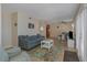 Open living space with a sofa, dining area, and sliding glass doors leading outside at 105 Pompano Se Dr # A, St Petersburg, FL 33705