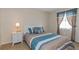 Bedroom with dresser, double bed, and window at 105 Pompano Se Dr # A, St Petersburg, FL 33705