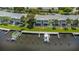 Aerial view of waterfront property with boat slips at 105 Pompano Se Dr # A, St Petersburg, FL 33705