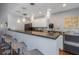 Community kitchen with modern appliances and bar seating at 105 Pompano Se Dr # A, St Petersburg, FL 33705