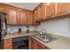 Well-equipped kitchen with ample wood cabinets and modern appliances at 105 Pompano Se Dr # A, St Petersburg, FL 33705