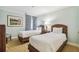 Bedroom with two twin beds, nightstands and window at 36750 Us Highway 19 N # 05102, Palm Harbor, FL 34684
