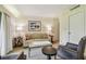 Cozy living room with a sofa, armchairs, and coffee table at 36750 Us Highway 19 N # 05102, Palm Harbor, FL 34684