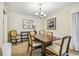 Bright dining room with wood table and chairs, and a chandelier at 36750 Us Highway 19 N # 05102, Palm Harbor, FL 34684