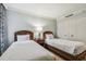 Bedroom with two twin beds and wooden frames at 36750 Us Highway 19 N # 05102, Palm Harbor, FL 34684