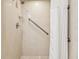 Walk-in shower with grab bar and tiled walls at 36750 Us Highway 19 N # 05102, Palm Harbor, FL 34684