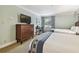 Bedroom with two beds, dresser and window at 36750 Us Highway 19 N # 05102, Palm Harbor, FL 34684