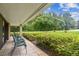 Private patio with seating and lush landscaping at 36750 Us Highway 19 N # 05102, Palm Harbor, FL 34684