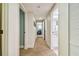 Hallway with carpet and access to bedrooms and bathrooms at 36750 Us Highway 19 N # 05102, Palm Harbor, FL 34684