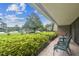 Patio with seating, lush landscaping, and views of the community at 36750 Us Highway 19 N # 05102, Palm Harbor, FL 34684