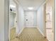 Light and airy entryway with carpet, closet, and access to bathroom at 36750 Us Highway 19 N # 05102, Palm Harbor, FL 34684