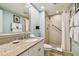 Bathroom featuring a shower, toilet and granite countertop at 36750 Us Highway 19 N # 05102, Palm Harbor, FL 34684
