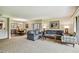 Open living room with comfortable seating and views of the dining area at 36750 Us Highway 19 N # 05102, Palm Harbor, FL 34684