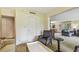 Bright living room with comfortable seating and view into dining area at 36750 Us Highway 19 N # 05102, Palm Harbor, FL 34684