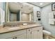 Double vanity bathroom with granite countertop and shower/tub combo at 36750 Us Highway 19 N # 05102, Palm Harbor, FL 34684