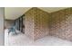 Brick patio with seating area and sliding glass doors at 36750 Us Highway 19 N # 05102, Palm Harbor, FL 34684