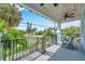 Front porch with seating area, ceiling fan, and street view at 222 Hope St, Tarpon Springs, FL 34689