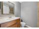 Clean bathroom with wood vanity and updated fixtures at 10155 Sailwinds S Blvd # 104, Largo, FL 33773