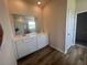 Elegant bathroom features a double sink vanity with marble countertops and sleek fixtures at 16044 7Th E Ave, Bradenton, FL 34212