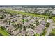 Vibrant suburban neighborhood with well-manicured lawns, mature trees, and diverse architectural styles at 4744 Woods Landing Ln, Tampa, FL 33619