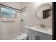Updated bathroom features a white subway tile shower, a pedestal sink, and a large vanity at 2111 Burlington N Ave, St Petersburg, FL 33713