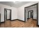 Bright hallway with dark wood trim and wood-look flooring at 2111 Burlington N Ave, St Petersburg, FL 33713