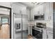 Stainless steel appliances and granite countertops highlight this updated kitchen at 2111 Burlington N Ave, St Petersburg, FL 33713