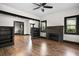 Living room with fireplace, built-in shelving, and hardwood floors at 2111 Burlington N Ave, St Petersburg, FL 33713