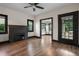 Living room featuring hardwood floors, fireplace, and access to sunroom at 2111 Burlington N Ave, St Petersburg, FL 33713