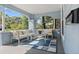 Relaxing front porch with seating and rug at 2111 Burlington N Ave, St Petersburg, FL 33713