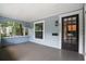 Front porch with black door and mailbox at 2111 Burlington N Ave, St Petersburg, FL 33713