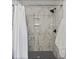 Clean and spacious shower with marble tile and a new shower head at 2111 Burlington N Ave, St Petersburg, FL 33713