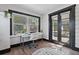 Sunroom with built in desk, hardwood floors, and French doors at 2111 Burlington N Ave, St Petersburg, FL 33713
