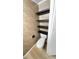 Small bathroom features tiled walls, toilet, and modern black shelving above at 4851 W Gandy Blvd # B11L35, Tampa, FL 33611