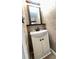 Bathroom with a sink and vanity with accent wall tiling at 4851 W Gandy Blvd # B11L35, Tampa, FL 33611