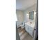 Bright bathroom featuring a single sink vanity, vinyl flooring, and modern fixtures at 4851 W Gandy Blvd # B11L35, Tampa, FL 33611