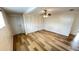 Bedroom with vinyl floors, fan, closet and a white entry door at 4851 W Gandy Blvd # B11L35, Tampa, FL 33611