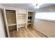 Bedroom with storage, built-in desk and shelving, and large window at 4851 W Gandy Blvd # B11L35, Tampa, FL 33611