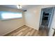 Bedroom featuring natural light, vinyl flooring, and neutral paint at 4851 W Gandy Blvd # B11L35, Tampa, FL 33611