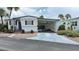 Charming single-story home with a covered patio, featuring well-maintained landscaping and a concrete driveway at 4851 W Gandy Blvd # B11L35, Tampa, FL 33611